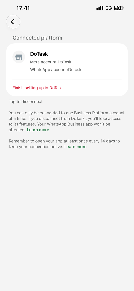 WhatsApp Business on the phone showing DoTask as the connected platform